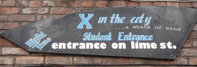 The student entrance at X in the City.
