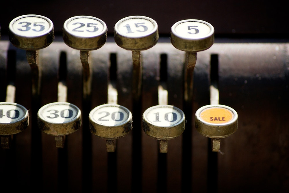 Image shows a vintage cash register